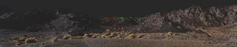 Long Omani landscape reconstructed in pink and green.